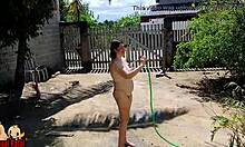 Bathing in the front yard is a joy for the nudist housewife